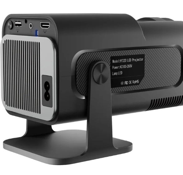 Portable R.E.D. Shopping mini projector displaying HD video for home entertainment on a blank wall.