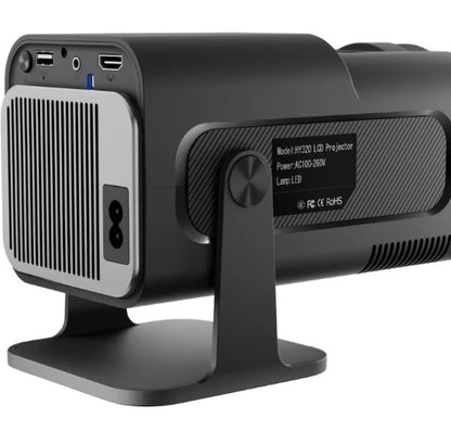 Portable R.E.D. Shopping mini projector displaying HD video for home entertainment on a blank wall.