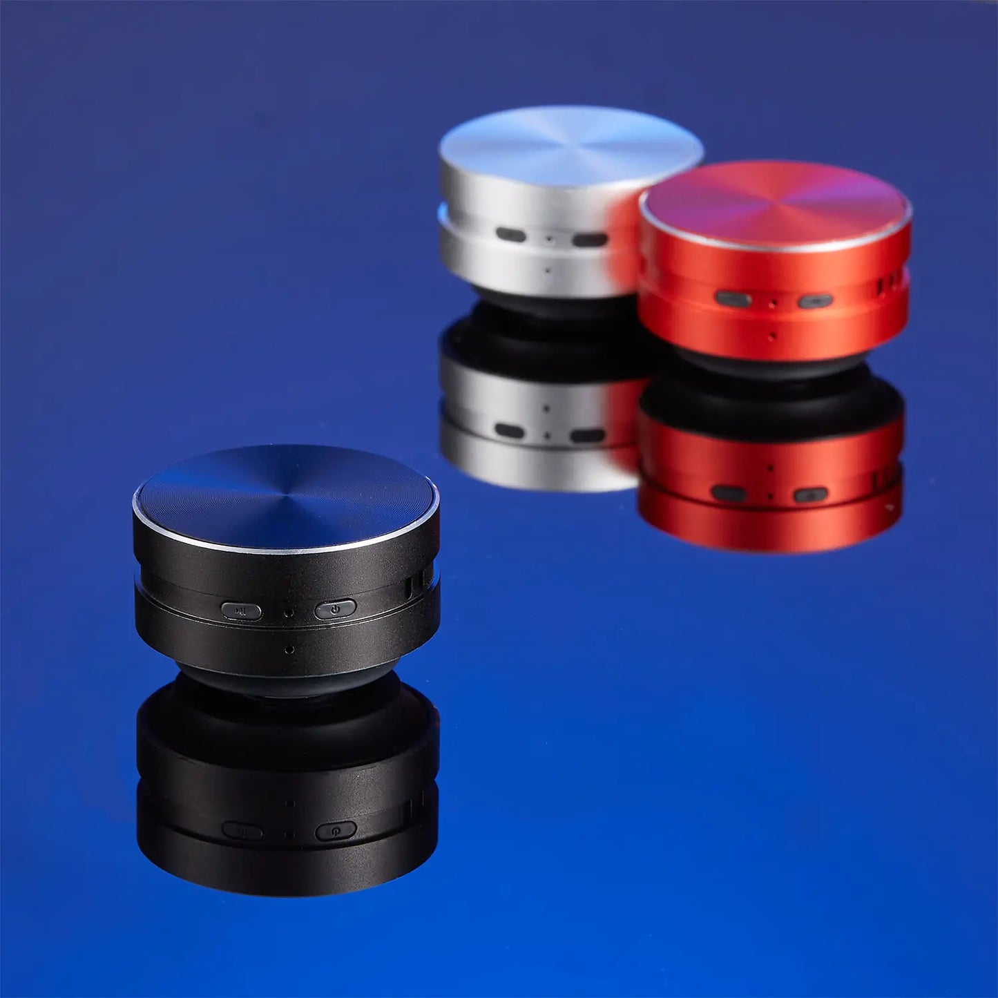 Red R.E.D. Shopping conduction speaker showing sleek design and control buttons on the front, perfect for portable audio.