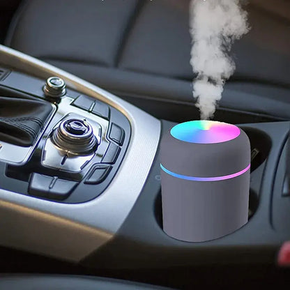R.E.D. Shopping Mini Air Humidifier for home use, compact white device with adjustable mist output on a wooden surface.