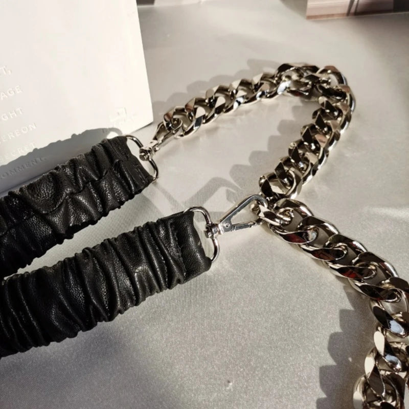 Women’s elastic leather silver chain belt with stretch corset waistband, fashionable accessory for stylish outfits.