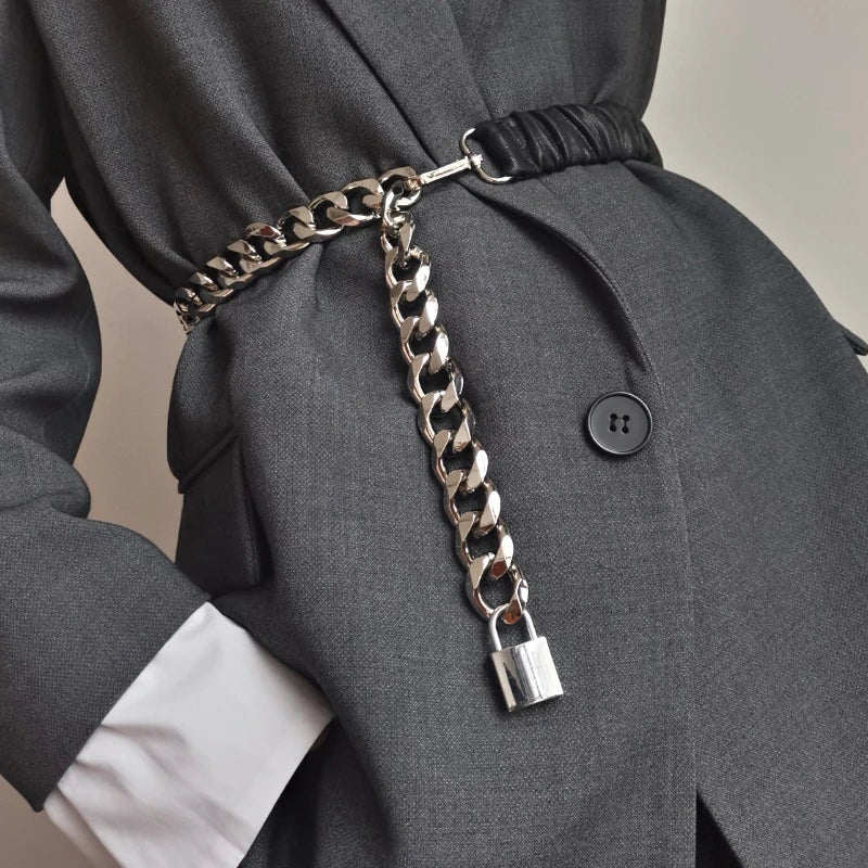 Women's elastic leather silver chain belt with stretch corset waistband, stylish accessory for fashion-forward outfits.