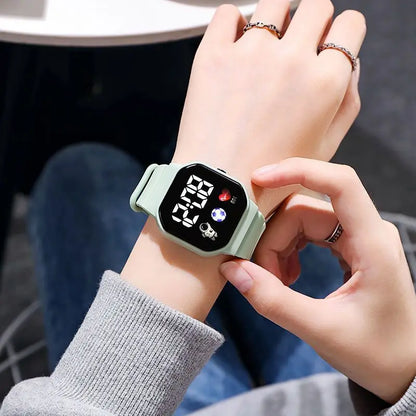 Kids LED digital sports watch with football design, silicone strap, suitable for boys and girls, by R.E.D. Shopping.
