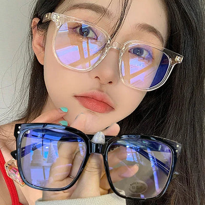 R.E.D. Shopping anti-blue light glasses for men and women, stylish computer eyewear with clear lenses and black frames.