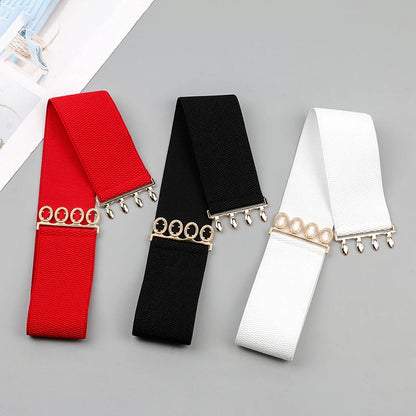 Women’s wide elastic waist belt with metal buckle from R.E.D. Shopping, featuring a corset-style design for cinching and style.