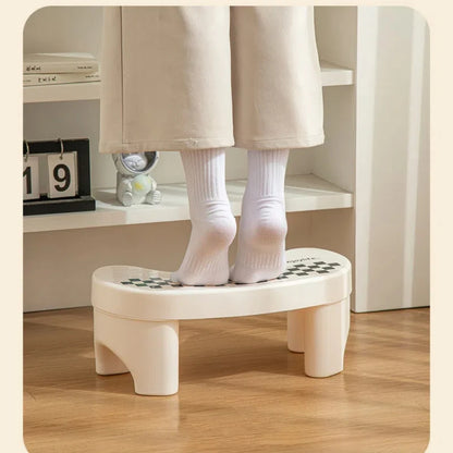 Plastic toilet footstool with non-slip pads, thickened base, designed for children and adults to improve bathroom comfort and posture.