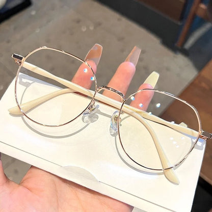 Clear Y2K-style round computer glasses by R.E.D. Shopping with transparent frames and anti-blue light lenses.