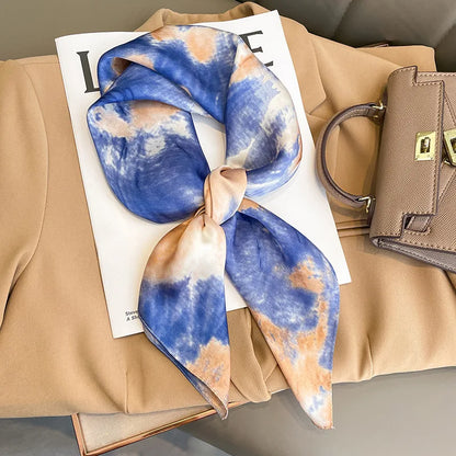 Elegant square silk scarf by R.E.D. Shopping, styled as a women's hairband and neck shawl, showcasing vibrant patterns.