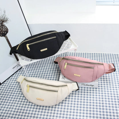 Women's R.E.D. Sports Waist Bag with multiple compartments, designed for outdoor activities, worn as a fanny pack or crossbody bag.