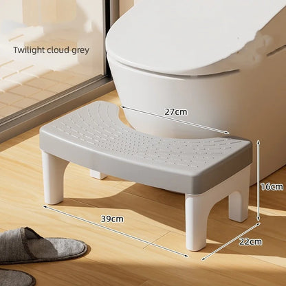 Plastic toilet footstool with non-slip pads, designed for children and adults, featuring thickened feet for stability in bathroom use.