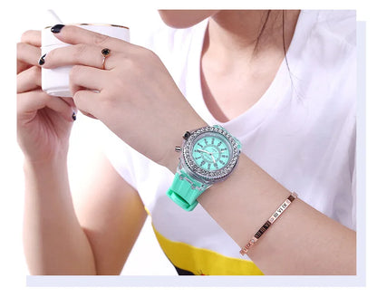 LED Flash Luminous Watch by R.E.D. Shopping with rhinestones, silicone band, and glowing display, suitable for kids and adults.