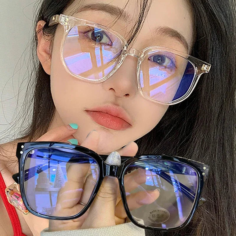 R.E.D. Shopping anti blue light glasses for men and women, stylish computer eyewear with clear lenses and black frames.