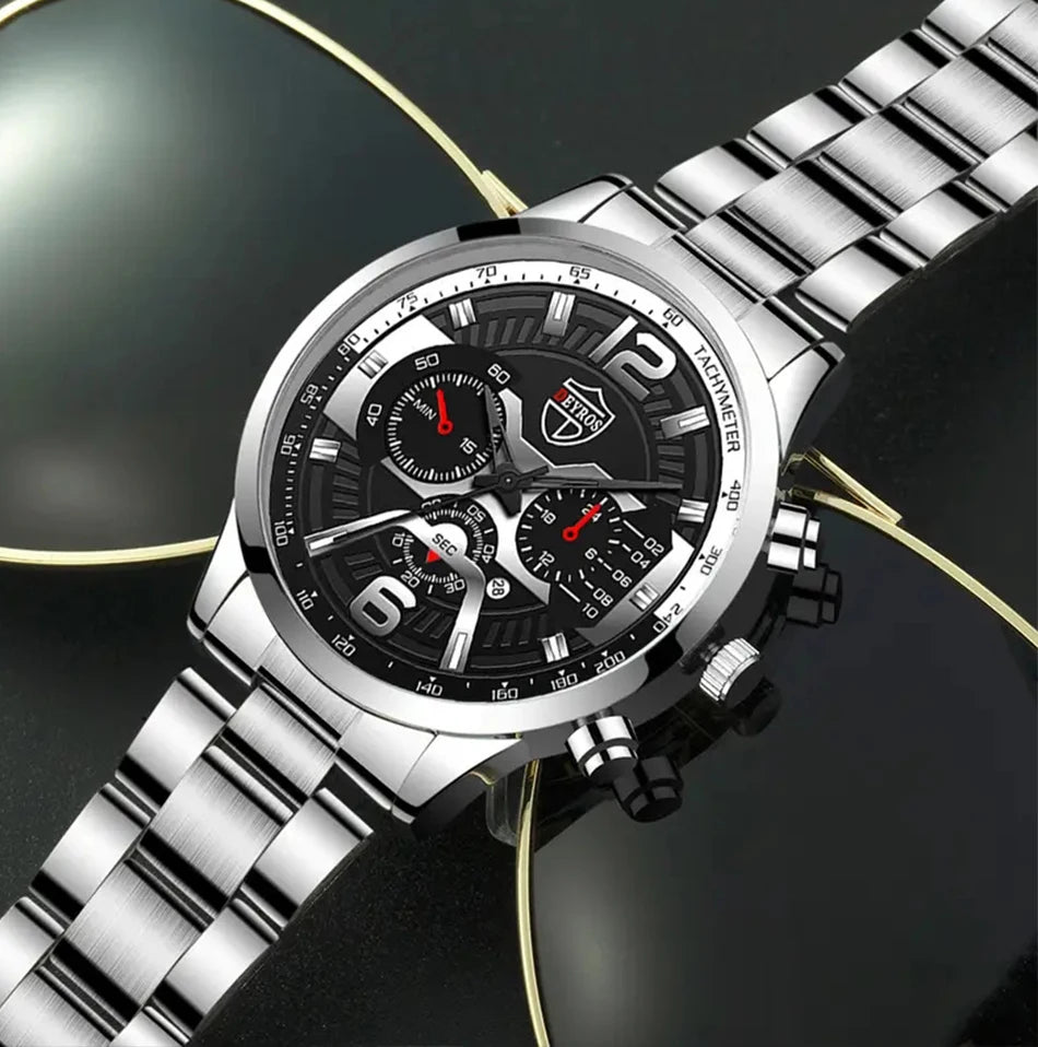 R.E.D. Shopping DEYROS 5-piece men's watch and jewelry gift set with quartz calendar watch, necklace, and bracelet on a display.