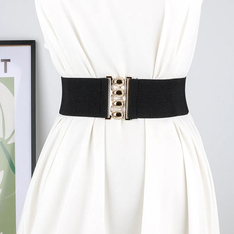 Women's wide elastic waist belt with metal buckle, corset style cinch belt from R.E.D. Shopping, stylish clothing accessory.