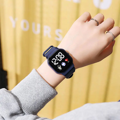 Kids LED digital sports watch with football design, silicone strap, suitable for boys and girls, by R.E.D. Shopping.