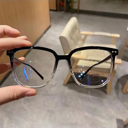 R.E.D. Shopping blue light blocking glasses for men and women, stylish computer eyewear with clear lenses and black frames.