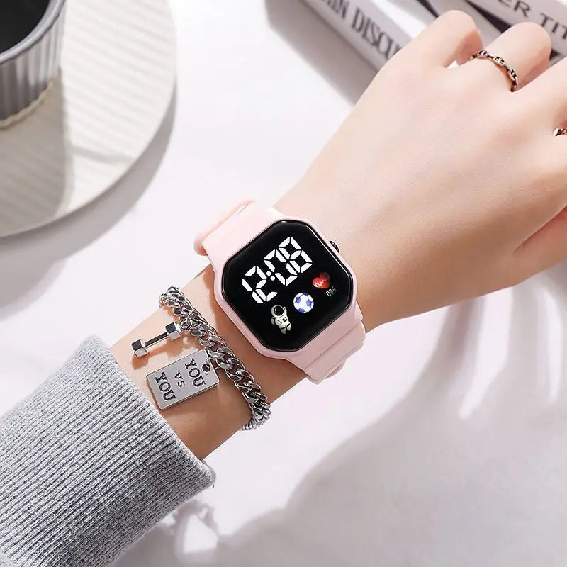 Kids LED digital sports watch with football design, silicone strap, suitable for boys and girls, by R.E.D. Shopping.
