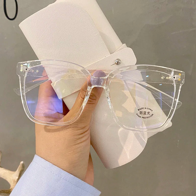 R.E.D. Shopping anti blue light glasses for men and women, stylish computer eyewear with clear lenses and black frames.