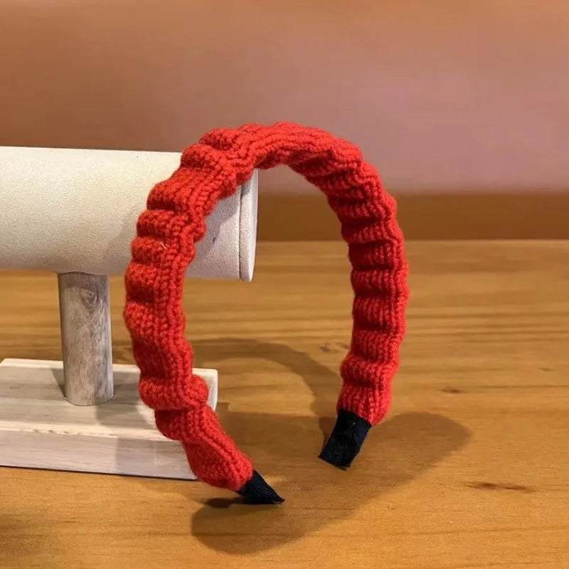 Red cloth Christmas fashion headband with vintage wool style, stylish hair accessory for holiday wear.