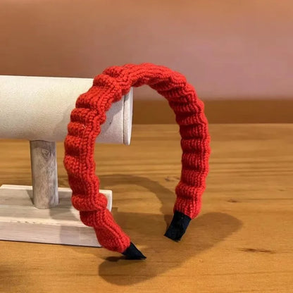Red cloth Christmas fashion headband with vintage wool style, stylish hair accessory for holiday wear.