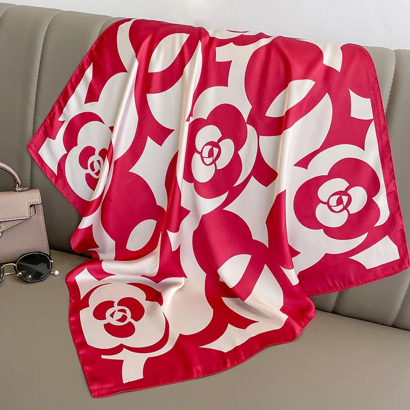 Red square silk scarf from R.E.D. Shopping, versatile as a women's hairband and neck shawl, with a smooth, shiny finish.