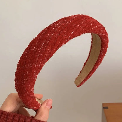 Red Christmas fashion headband with vintage wool style, festive cloth hair accessory for holiday celebrations.