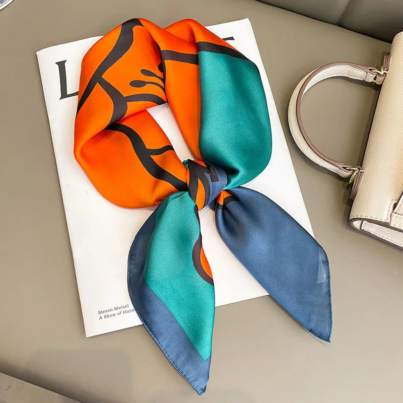 Elegant square silk scarf by R.E.D. Shopping, versatile hairband and neck shawl with vibrant floral pattern and soft fabric.