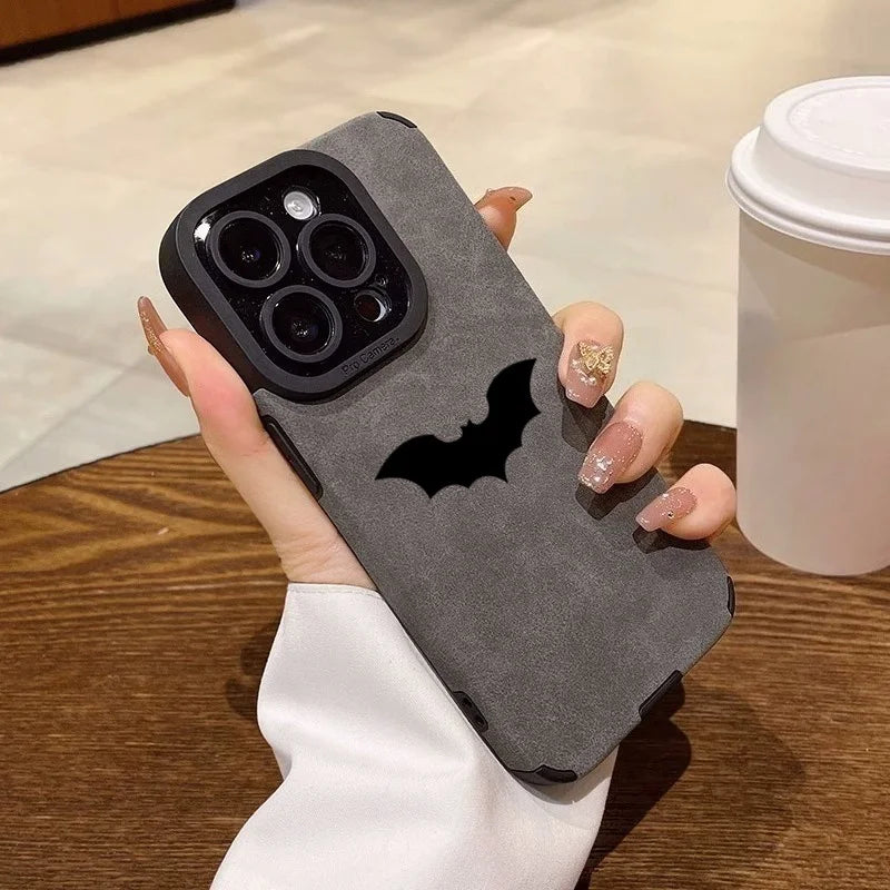 Black leather iPhone case with shockproof silicone edges, R.E.D. Shopping brand, featuring a sleek protective cover for mobile phones.