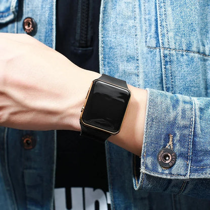 Digital LED watch with sport silicone wristband from R.E.D. Shopping, showing time display on a sleek, modern watch face.