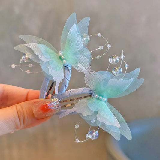Pair of gradient butterfly hair clips for girls and women, stylish R.E.D. Shopping hair accessories for daily or special occasions.