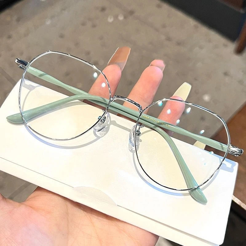 Clear Y2K-style transparent computer glasses with round frames and anti-blue light lenses, designed for stylish eyewear.