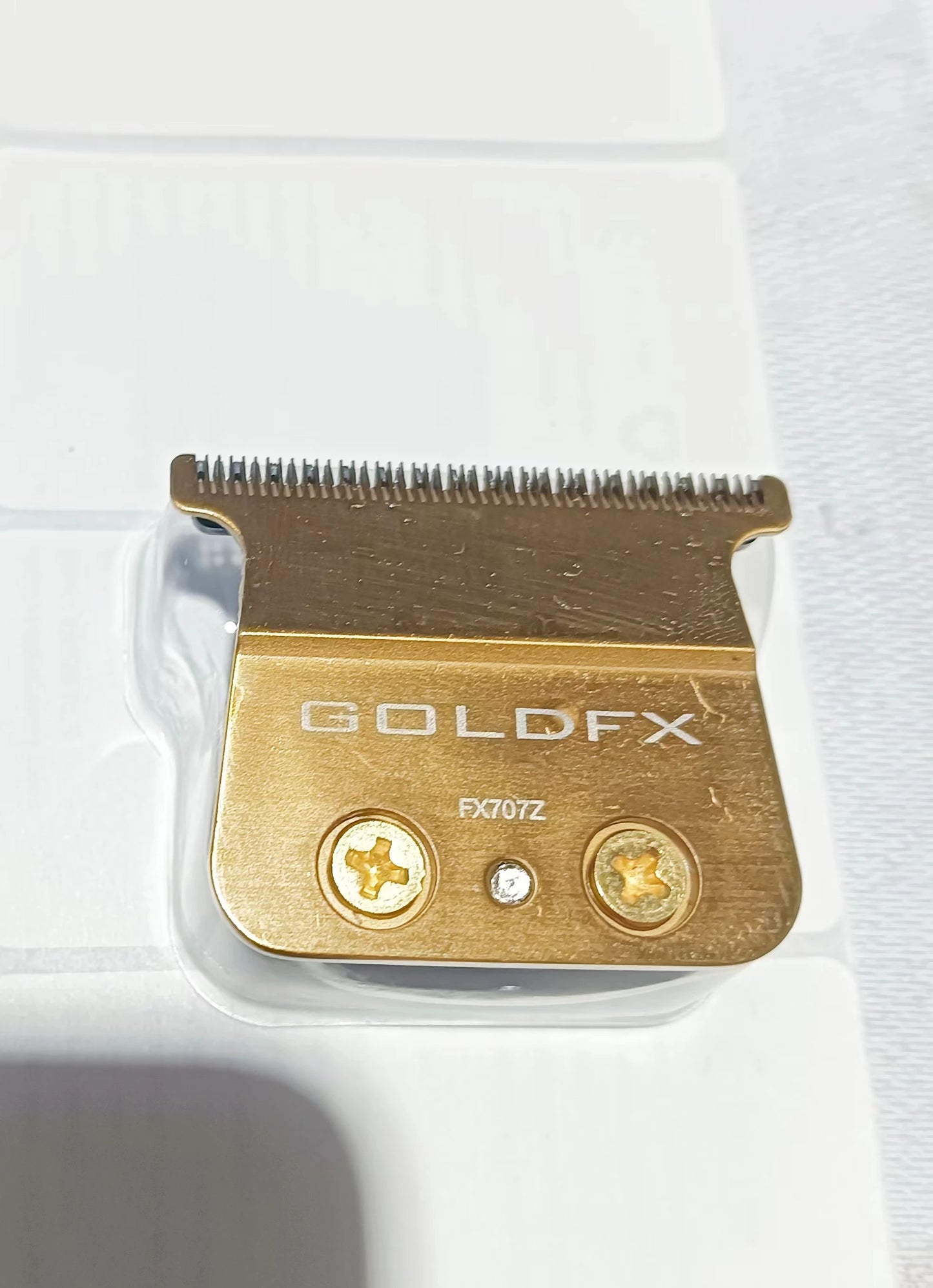 Titanium-coated FX707 blade compatible with BAB PRO trimmer, featuring durable steel for precise grooming and shaving.