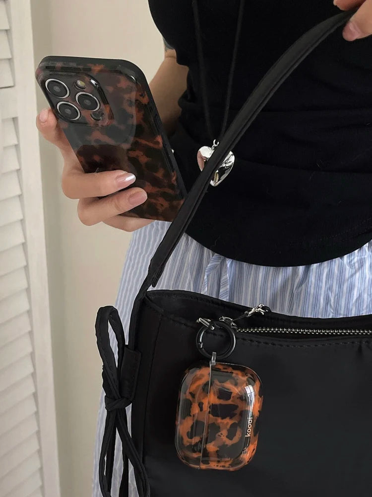 Retro amber leopard silicone iPhone case with animal print design, providing protective cover for mobile phones.