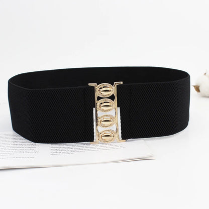 Women’s wide elastic waist belt with metal buckle and corset style, fashion accessory for cinching dresses or coats.