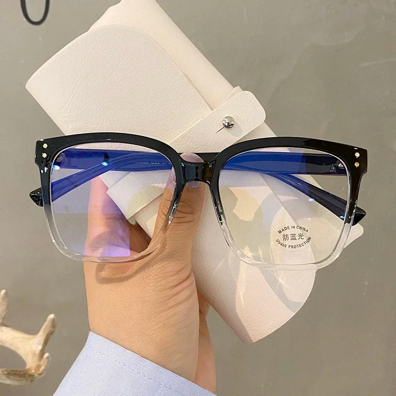 R.E.D. Shopping blue light blocking glasses for men and women, stylish computer eyewear with clear lenses and black frames.