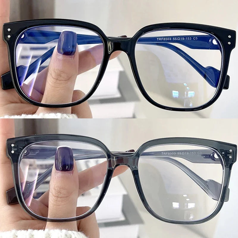 R.E.D. Shopping anti-blue light glasses for men and women, sleek computer eyewear with clear lenses and black frames.