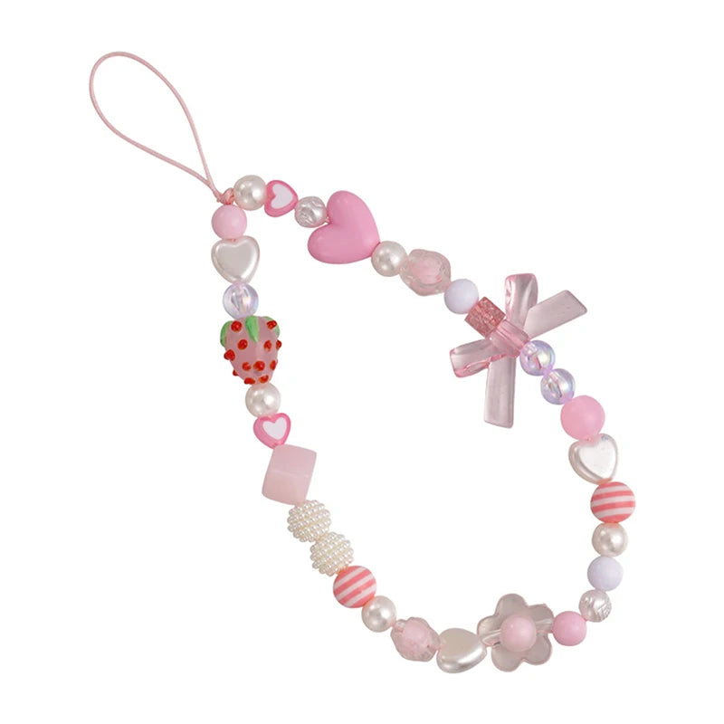 Sweet strawberry flower bead phone strap charm with pink and green beads, designed as a keychain and bag accessory for women.