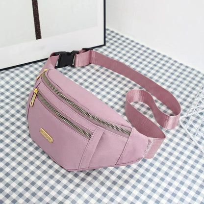 Women's R.E.D. Shopping sports waist bag with multiple compartments, worn as a fanny pack or crossbody for outdoor activities.