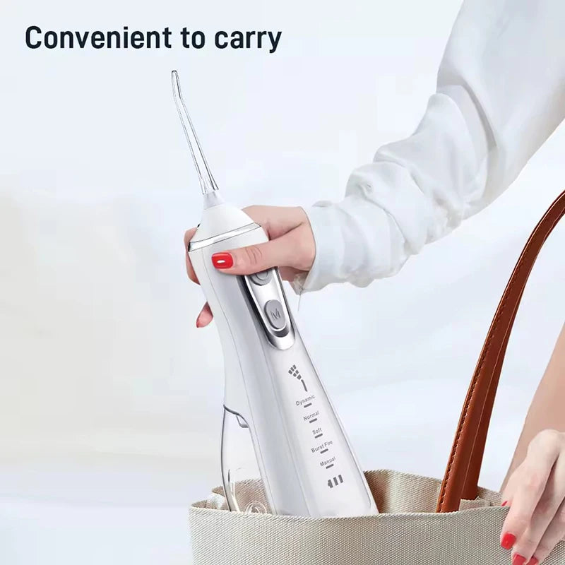 Portable R.E.D. Shopping oral irrigator with 4 nozzles, 300ml water tank, waterproof design, and 5 flossing modes.