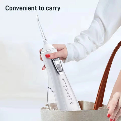 Portable R.E.D. Shopping oral irrigator with 4 nozzles, 300ml water tank, waterproof design, and 5 flossing modes.