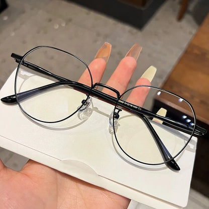 Clear Y2K-style transparent computer glasses with round frames and blue light filtering, designed for stylish eyewear.