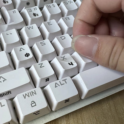 R.E.D. Shopping Russian language tear-off film keyboard sticker on a laptop keyboard, featuring side engraving for easy key identification.