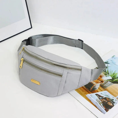 Women’s sports waist bag by R.E.D. Shopping featuring multi-layer design, suitable for outdoor activities, worn as a fanny pack or crossbody.