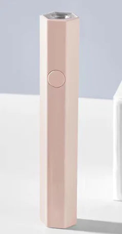 Mini UV LED nail lamp from R.E.D. Shopping for gel polish curing, compact design with multiple LED bulbs for quick drying.